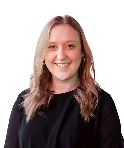 A smiling woman with ombre hair, an event planner, wearing a black top against a white background.