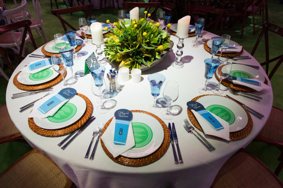 table set for party with menus at each place.