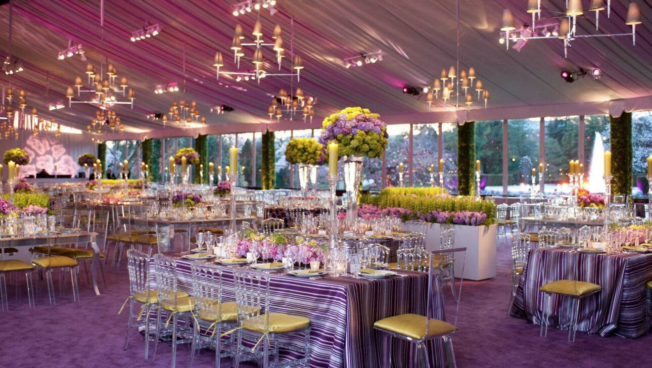 purple hued room decorated for a party.