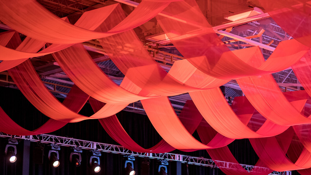 large red ribbons hanging from ceiling.