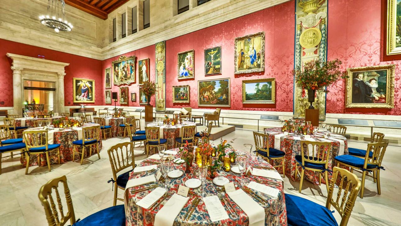 decorated tables in a museum hall.