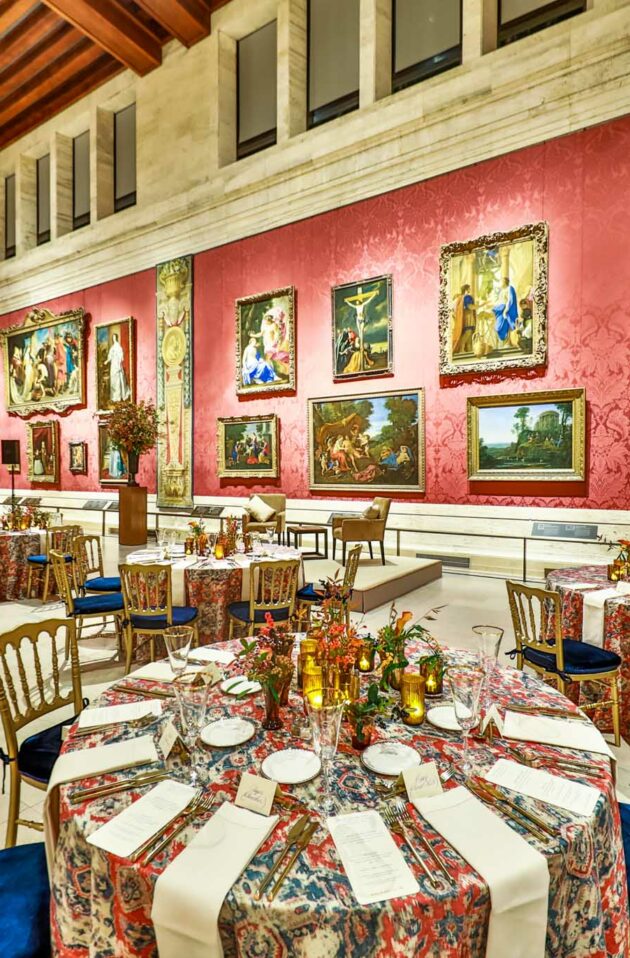 decorated tables in a museum hall.