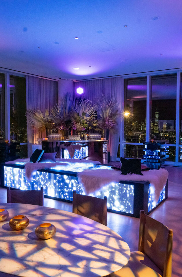 neon lit tropical decorated club space in a highrise building.
