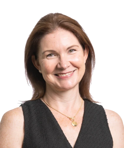 A smiling woman with shoulder-length hair wearing a sleeveless black top and a necklace, part of a professional event planning company team.
