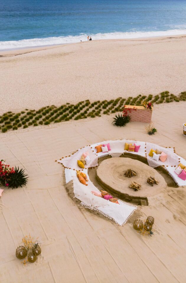 lounge dug into the sand on a beach.