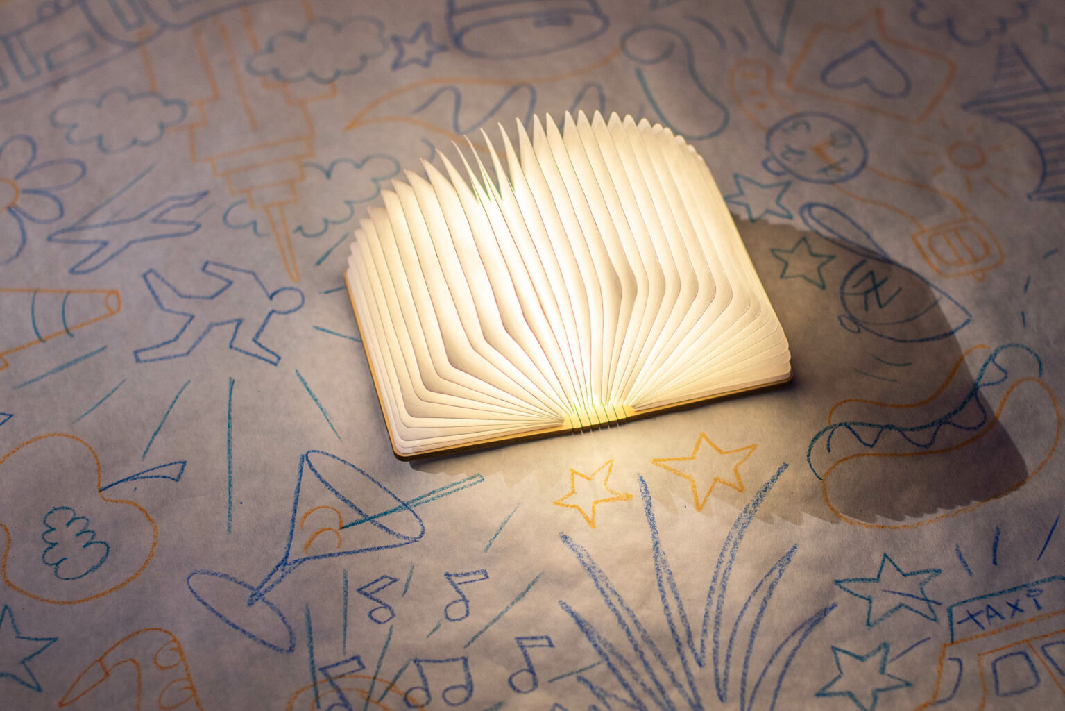 light centerpiece that looks like an open book with the pages fanning out.