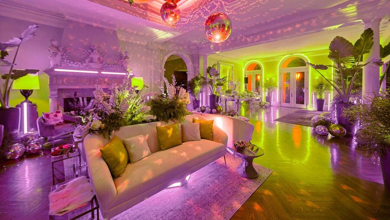 decorated purple-lit lounge room.