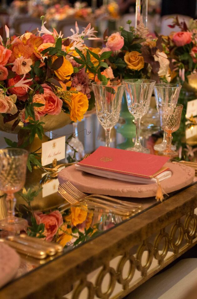 decorated table with floral centerpieces.