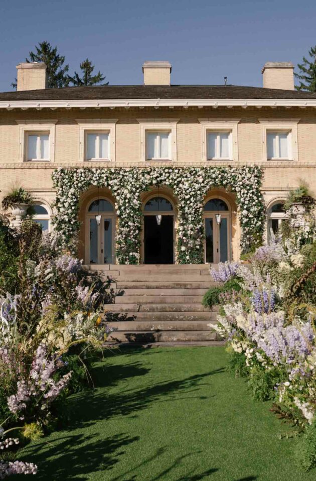 wedding setting on the lawn in front of an estate.