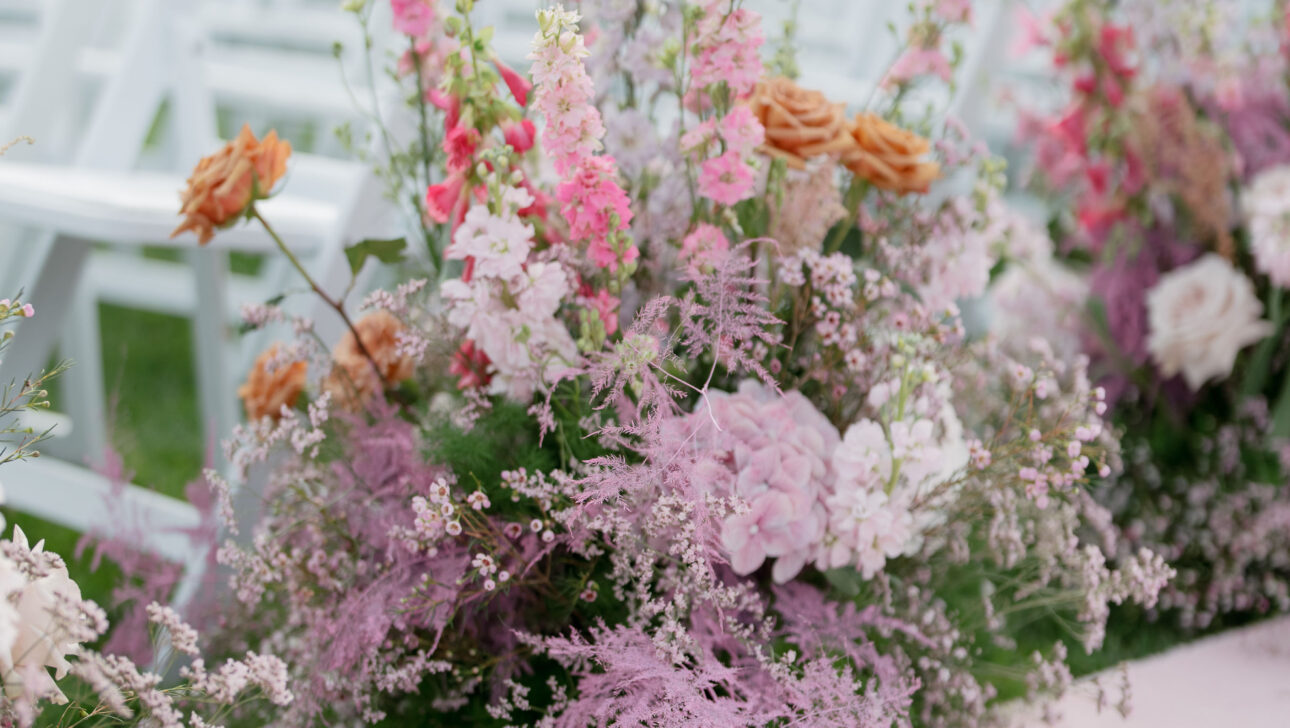 Martha's Vineyard Destination Wedding Ceremony Decor. Pink, white and purple florals. Designed by Rafanelli Events.