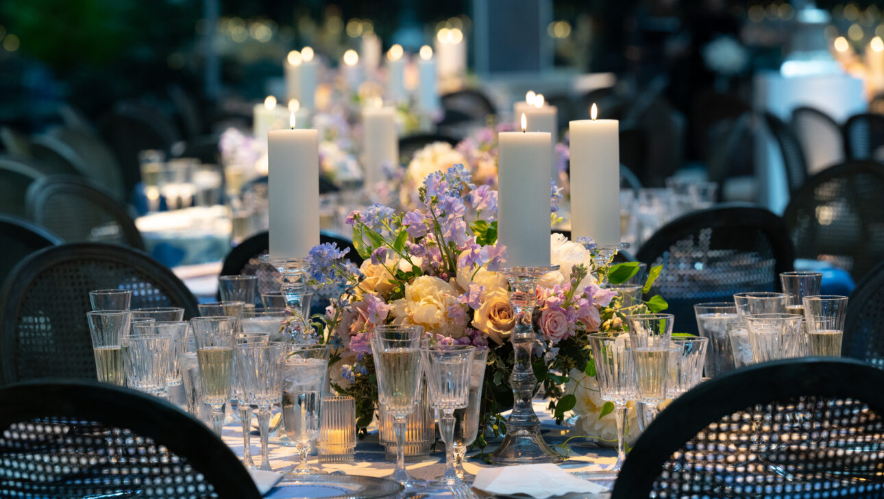 Wedding table scape with beautiful colorful florals. Designed by Rafanelli Events.