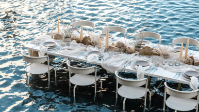 Mexico destination wedding table setting with stunning dinner table scape set in the water.